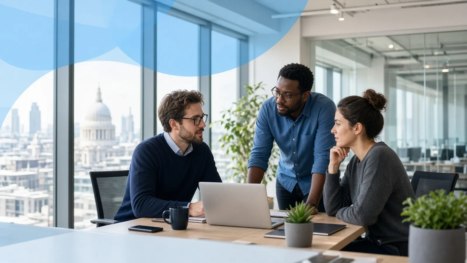 UK software development team discussing a custom application in a modern London office